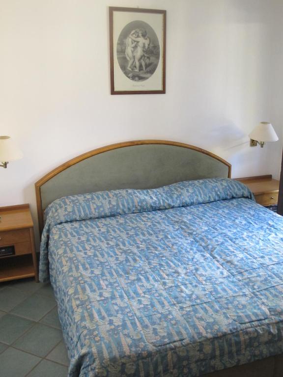 Postel nebo postele na pokoji v ubytování Hotel Pagnani