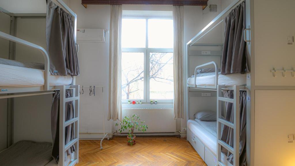 Postel nebo postele na pokoji v ubytování T5 Social