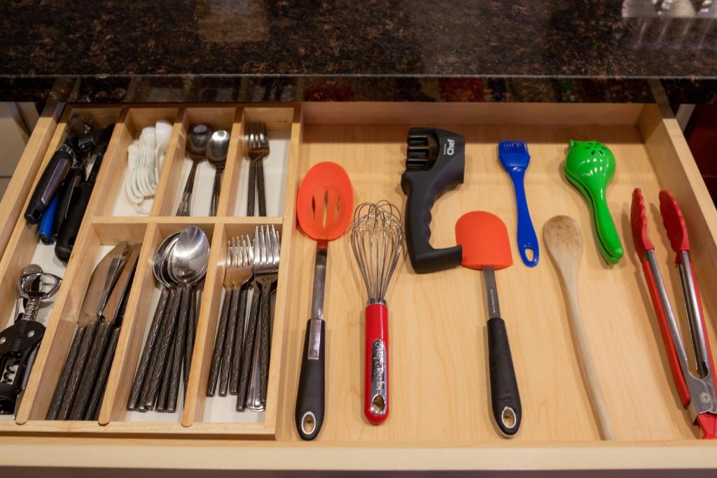 a drawer filled with utensils on top of a counter at Misty Mountain- Premium 2 Bedroom Mountain View in Canmore