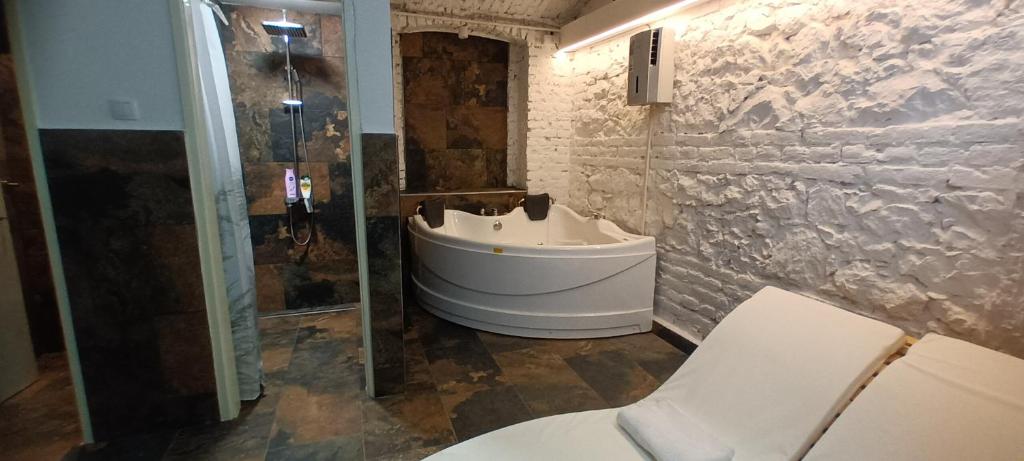 a bathroom with a white sink and a shower at 10 PERCENT OFF UNTIL 31ST OF OCTOBER - Old Café Spa Apartment in Belgrade