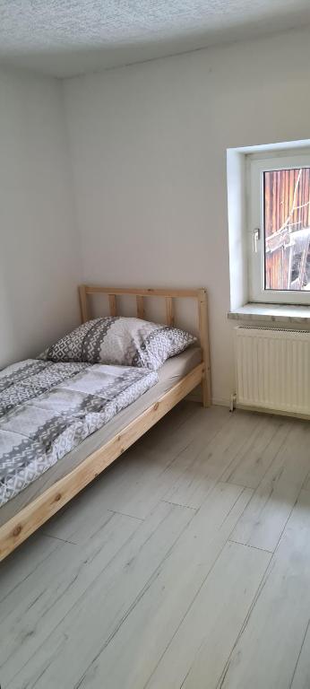 Postel nebo postele na pokoji v ubytování SG Apartment