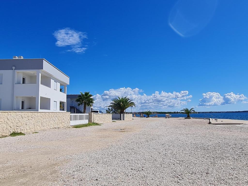 Via apartment first row by the sea