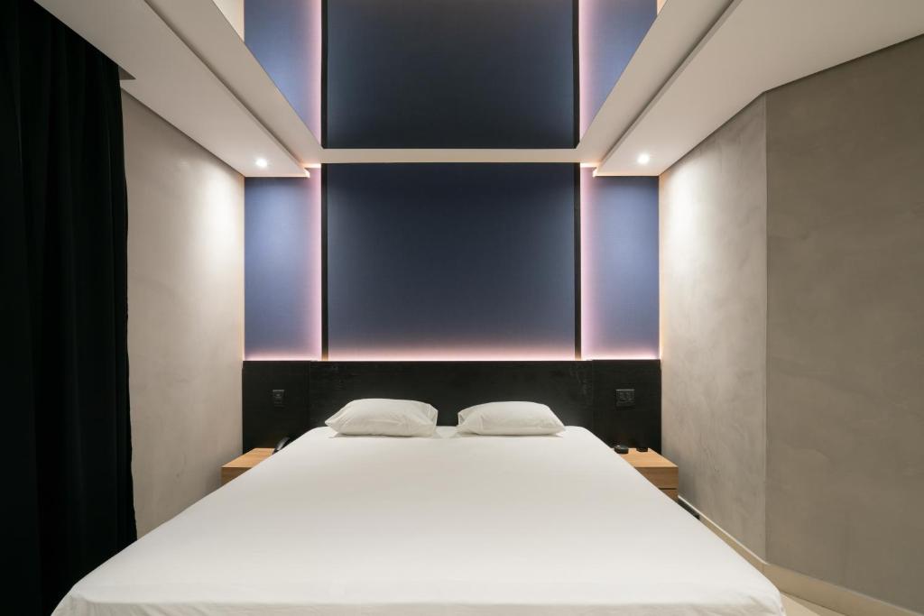 Postel nebo postele na pokoji v ubytování Taikô Motel by Drops