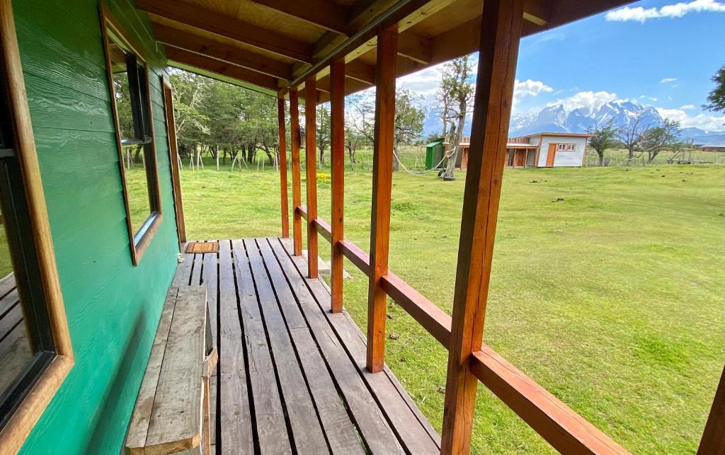 a porch of a house with a view of a field at Cabañas Vista al Paine in Torres del Paine