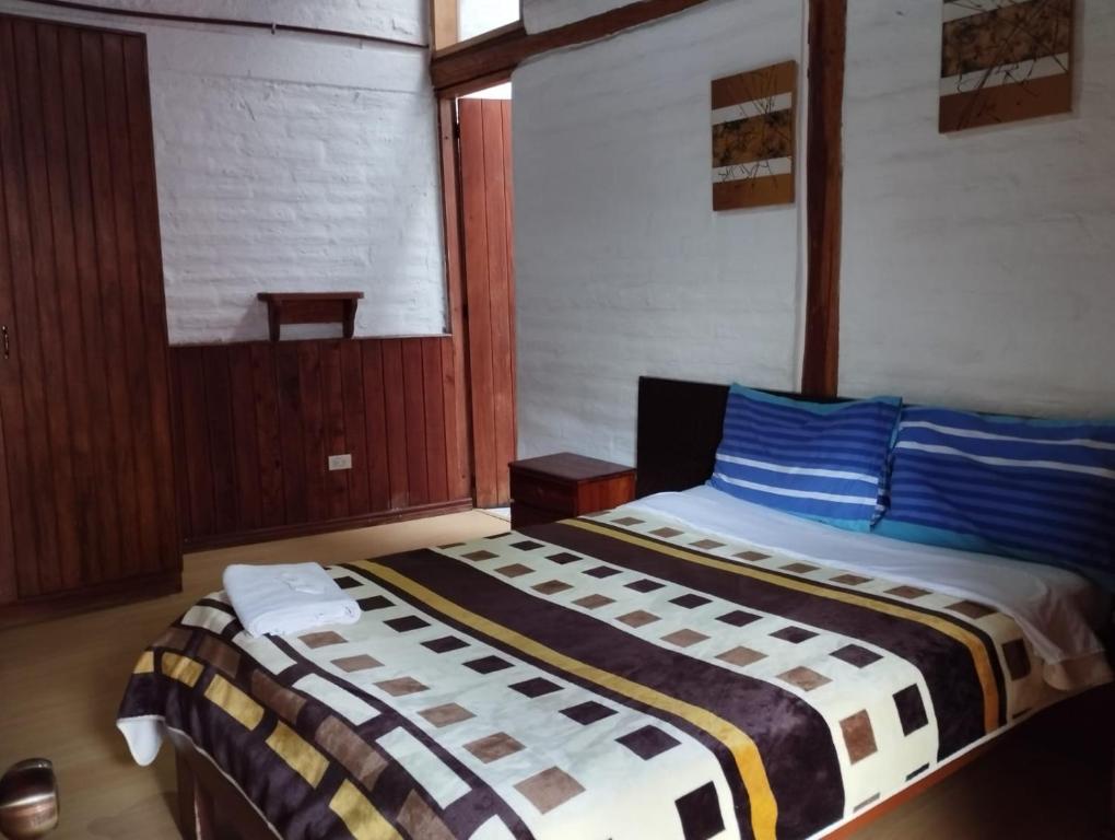 Postel nebo postele na pokoji v ubytování Hostal La Catolica