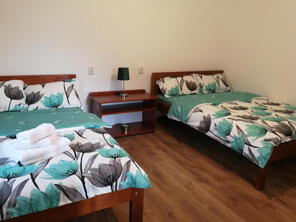 Postel nebo postele na pokoji v ubytování Căsuțe Zăvoi Bulz