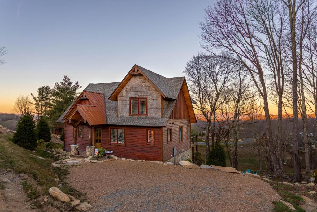 a house sitting on top of a hill at The Grape Escape at Eagles Nest in Elk Park