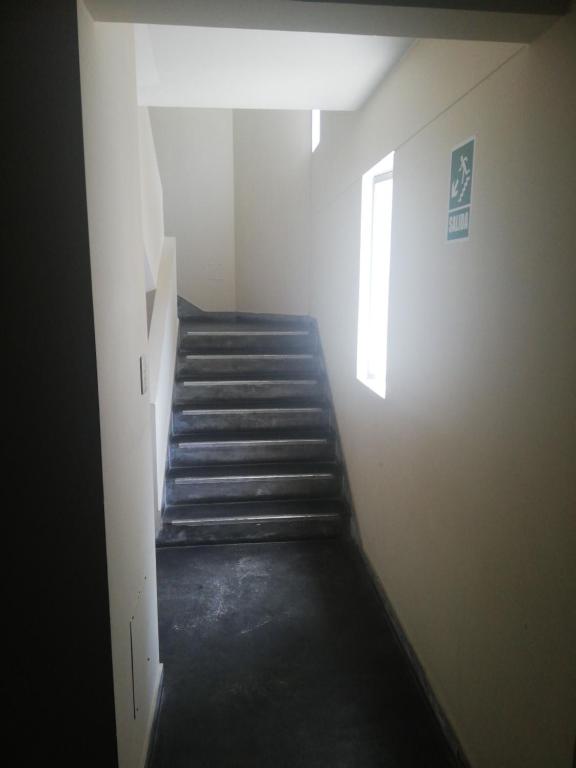 a hallway with a staircase in a building at MIRAFLORES APART-10Beds-11Persons-Pool-Grill-Garage-Near Kennedy Park in Lima