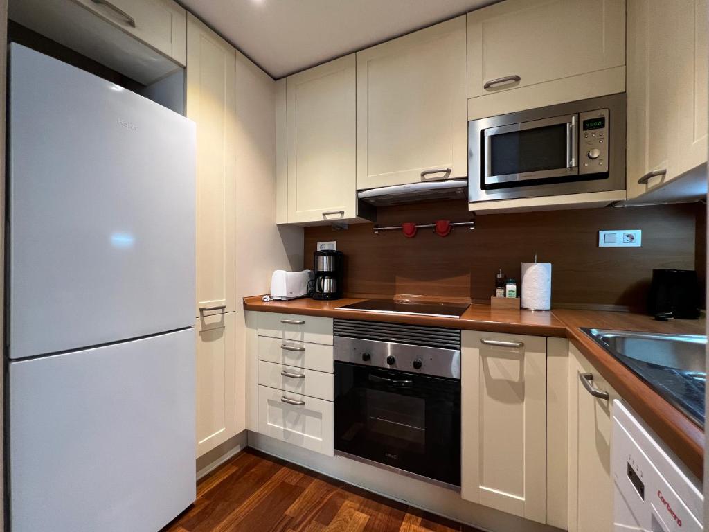 A kitchen or kitchenette at Stay Unique Apartments Bruc