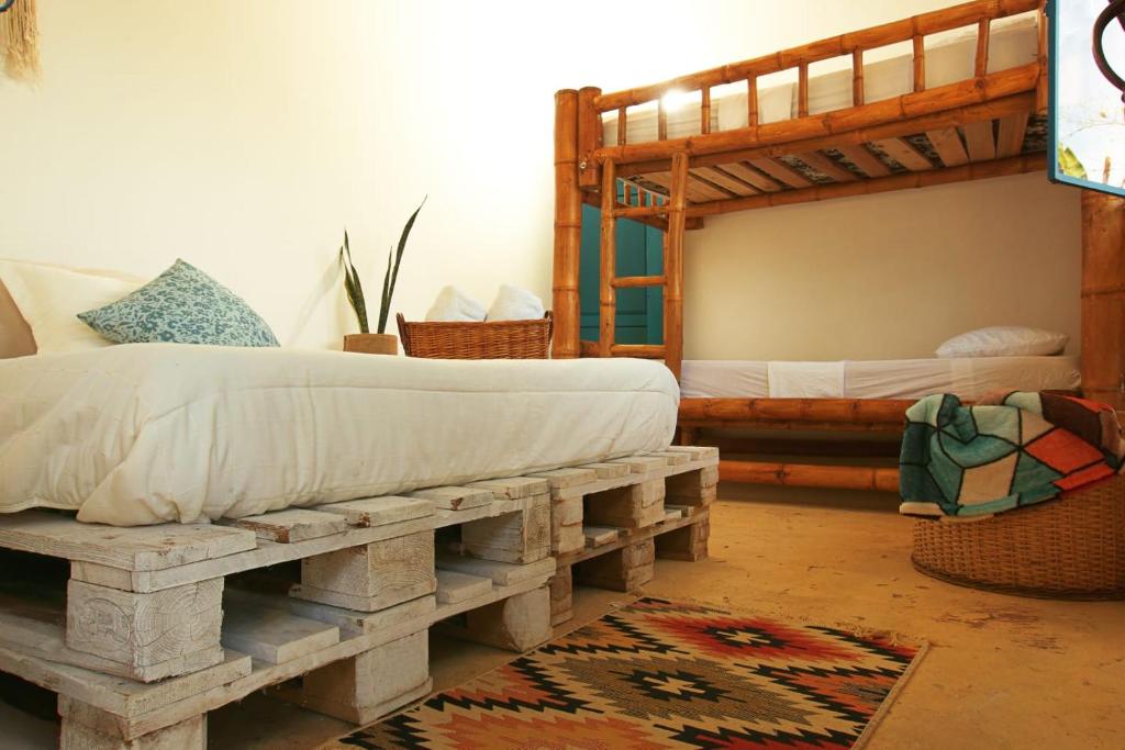 Postel nebo postele na pokoji v ubytování Casa Mostaza-Ecolodge