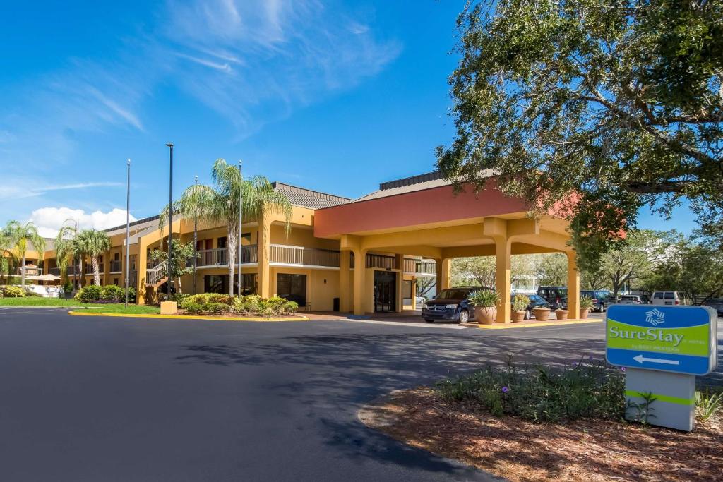 a building with a sign in front of it at SureStay Hotel by Best Western St Pete Clearwater Airport in Clearwater