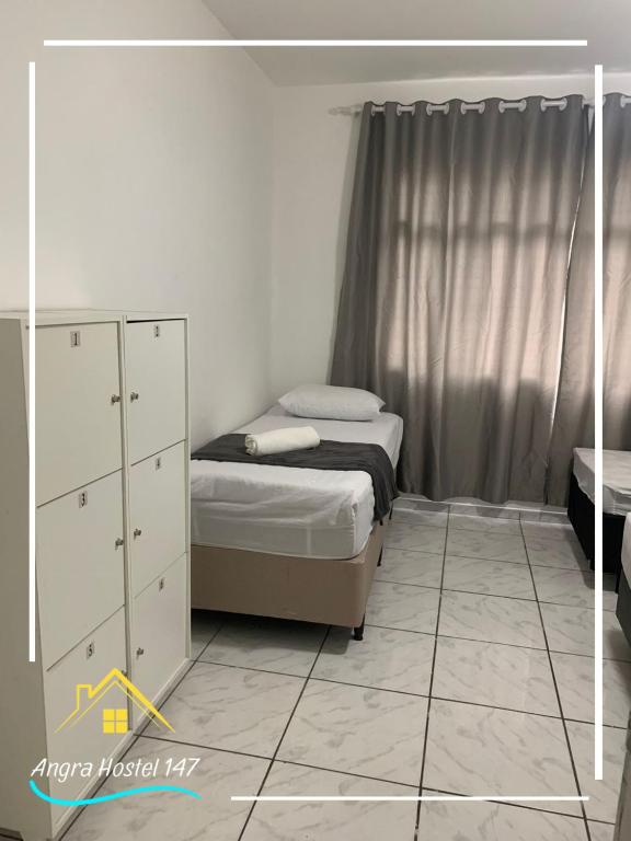Postel nebo postele na pokoji v ubytování Angra Hostel 147