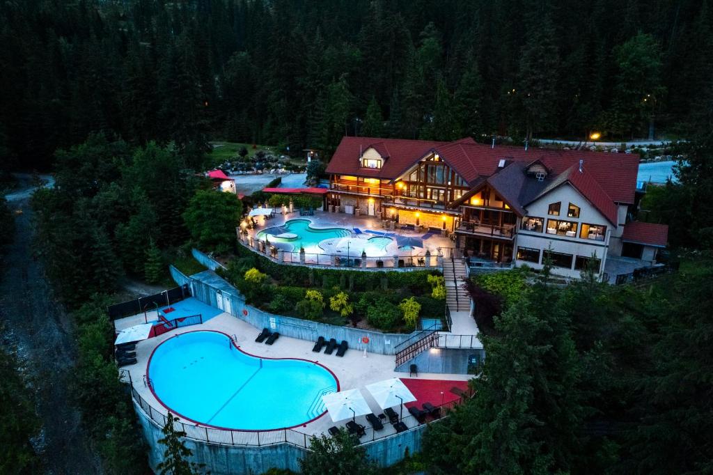 an aerial view of a house with two swimming pools at Halcyon Hot Springs Resort in Halcyon Hot Springs