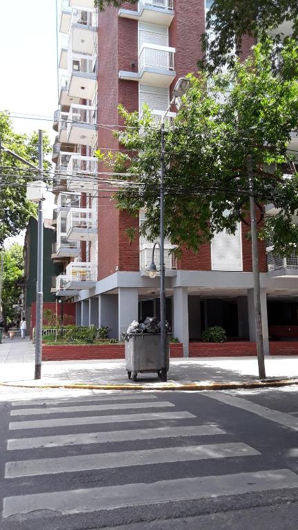 an empty street in front of a tall building at SANFER in San Fernando