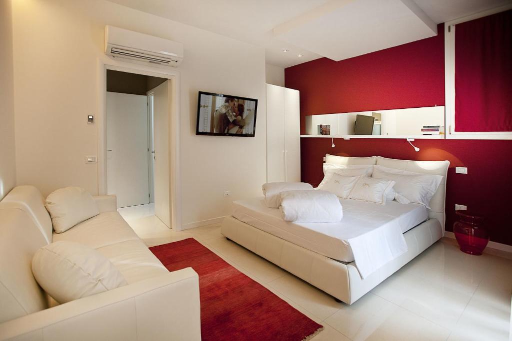 Postel nebo postele na pokoji v ubytování Opera Relais De Charme - Aparthotel