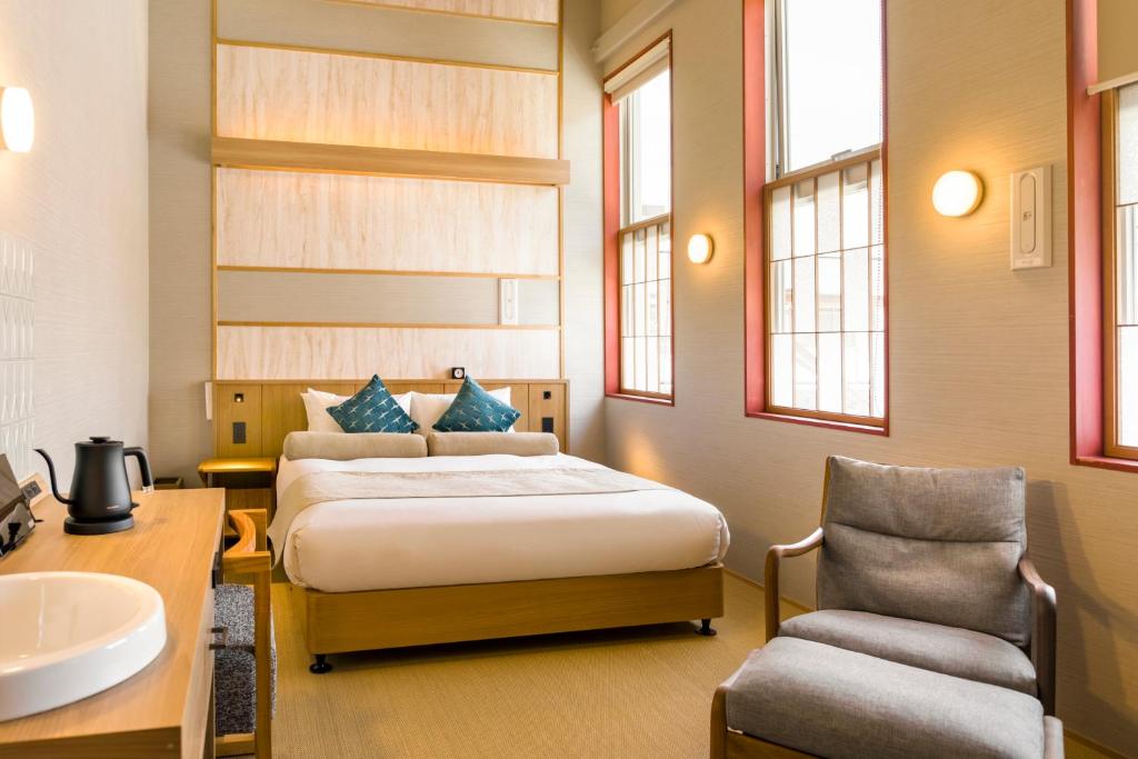 Postel nebo postele na pokoji v ubytování HOTEL BEACON ONOMICHI