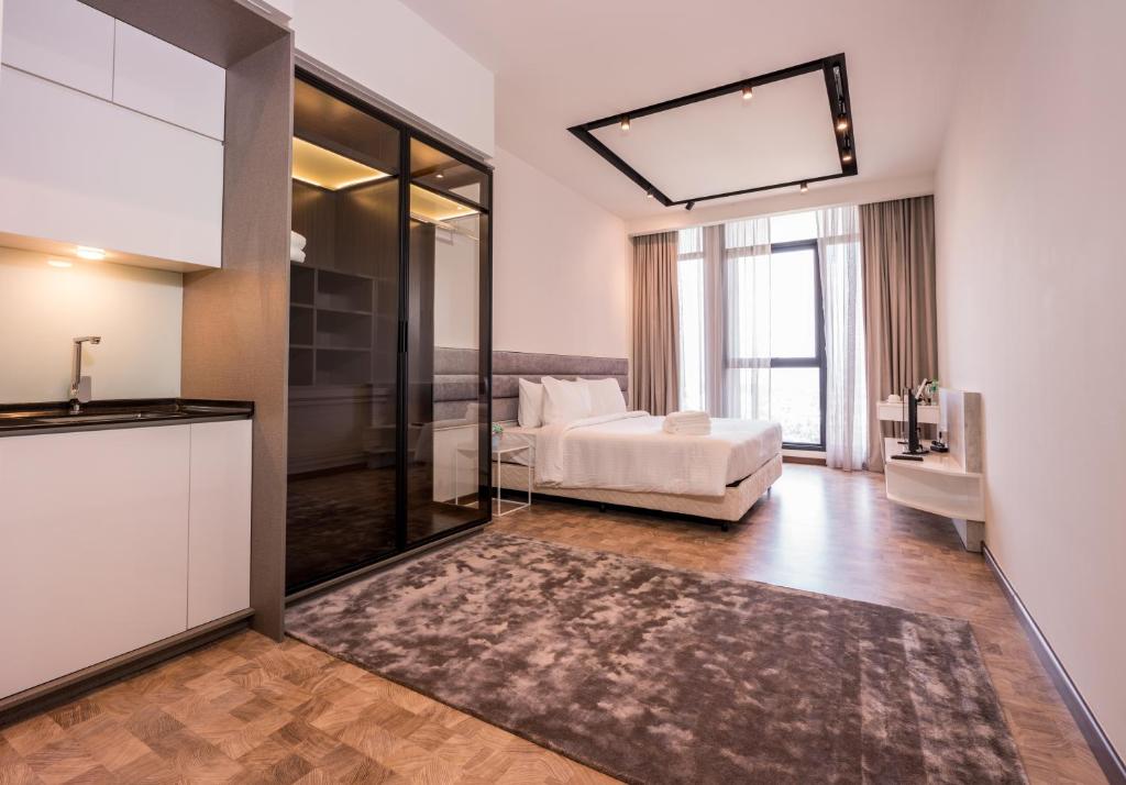 Postel nebo postele na pokoji v ubytování ExpressionZ Suites KLCC