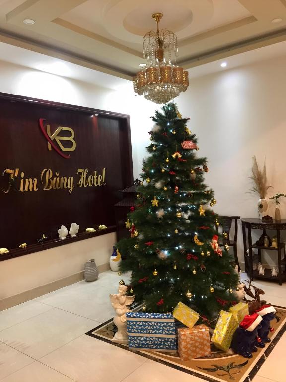 a christmas tree in the lobby of a hotel at KIM BĂNG HOTEL BÌNH DƯƠNG in Thu Dau Mot