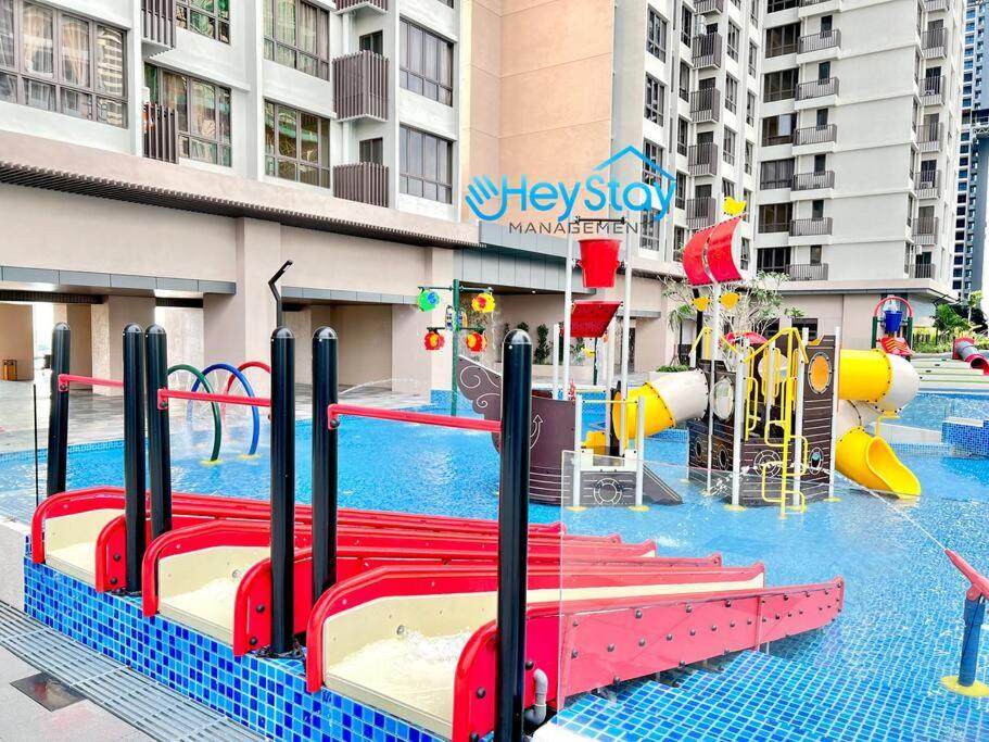 a pool with a water park with a playground at Bali Residence Melaka By Heystay Management in Malacca