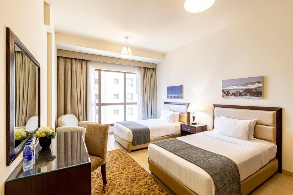 Postel nebo postele na pokoji v ubytování Roda Amwaj Suites Jumeirah Beach Residence