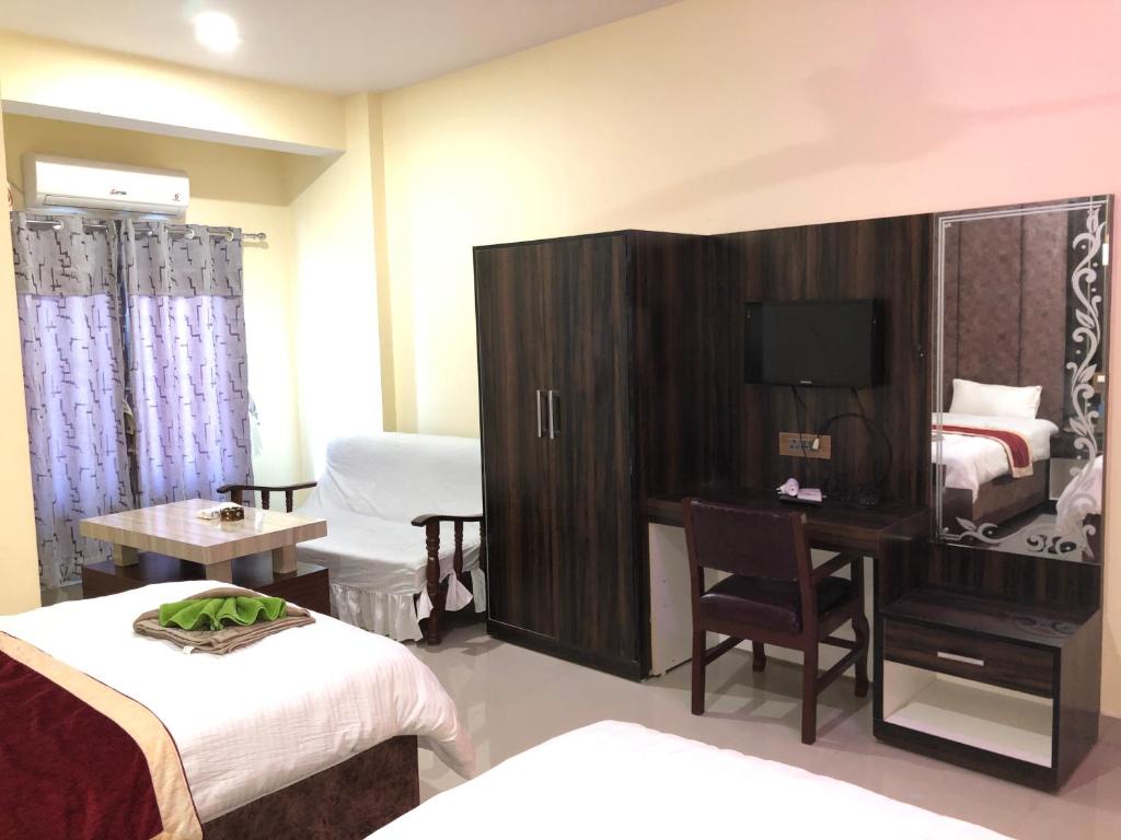 Postel nebo postele na pokoji v ubytování Hotel Hot Pot, Dhangadhi