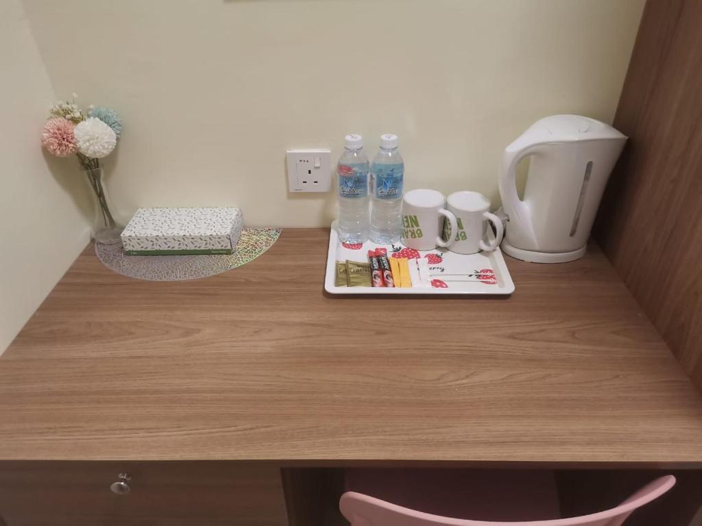 Příslušenství pro přípravu čaje a kávy v ubytování SCC Hotel Chinatown