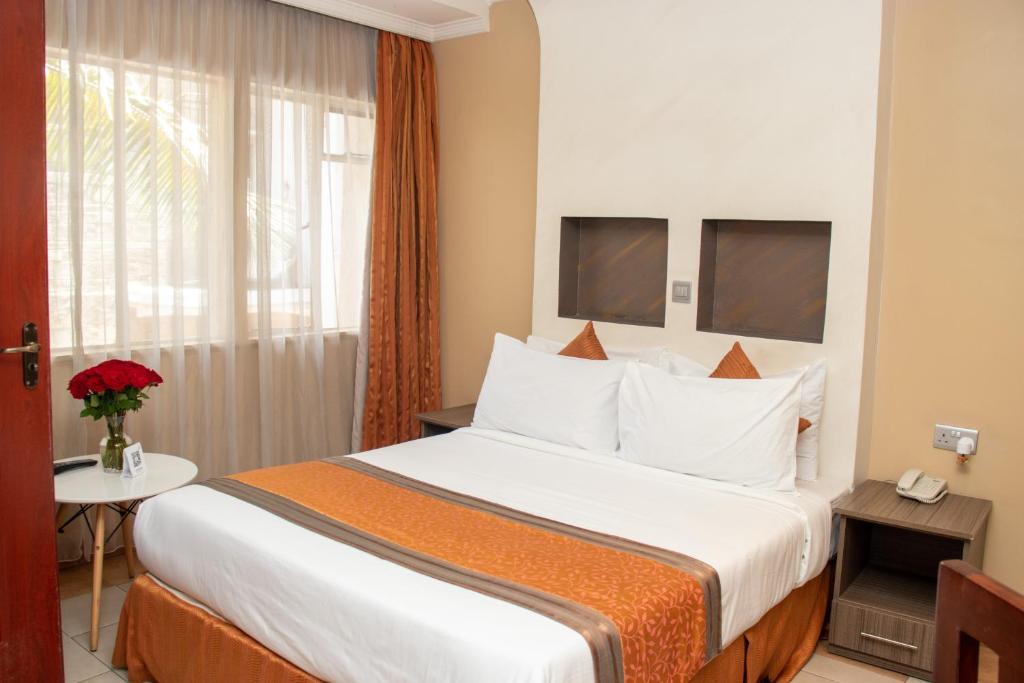 Postel nebo postele na pokoji v ubytování Hotel Waterbuck