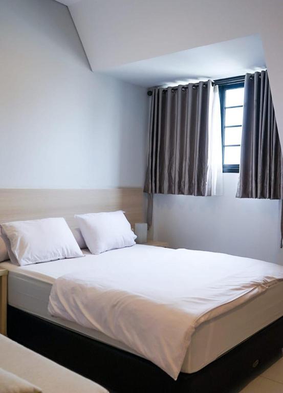 Postel nebo postele na pokoji v ubytování Mendjangan Residence