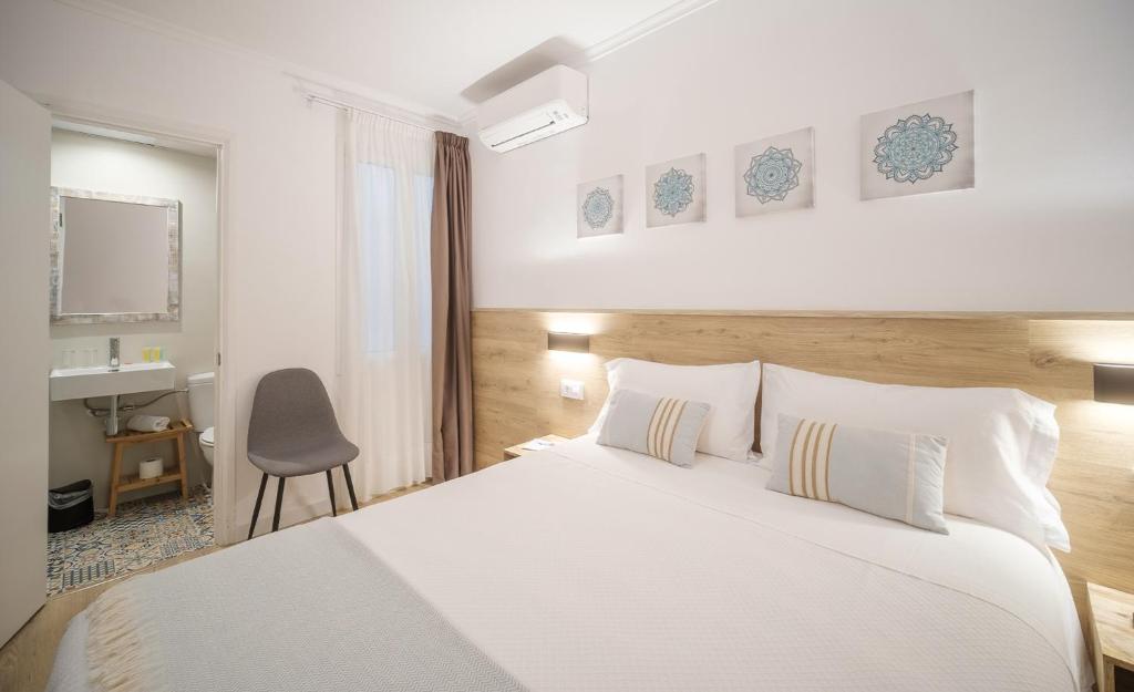 Posteľ alebo postele v izbe v ubytovaní Hostal Menurka