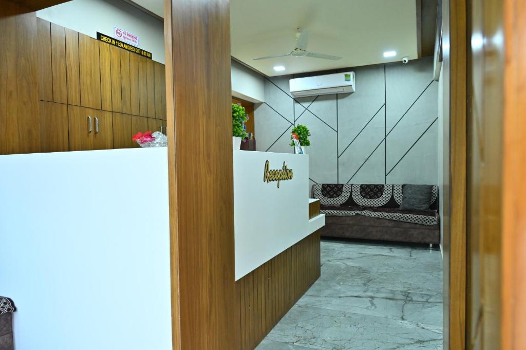 an office door with a sign that reads urgent at HOTEL SURY VILLA in Ahmedabad
