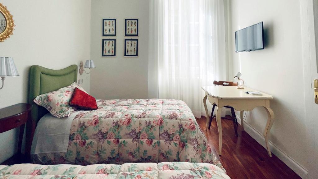 A bed or beds in a room at B&B CORSO VITTORIO
