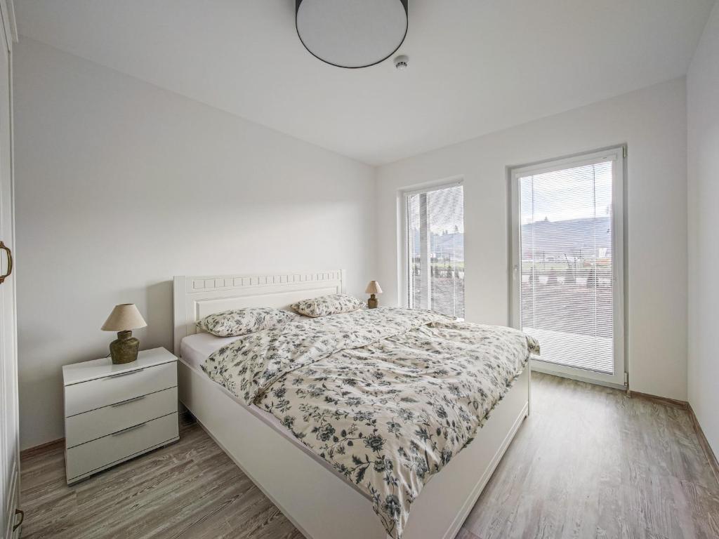 Postel nebo postele na pokoji v ubytování Chalets New Apartmány Ivachnová