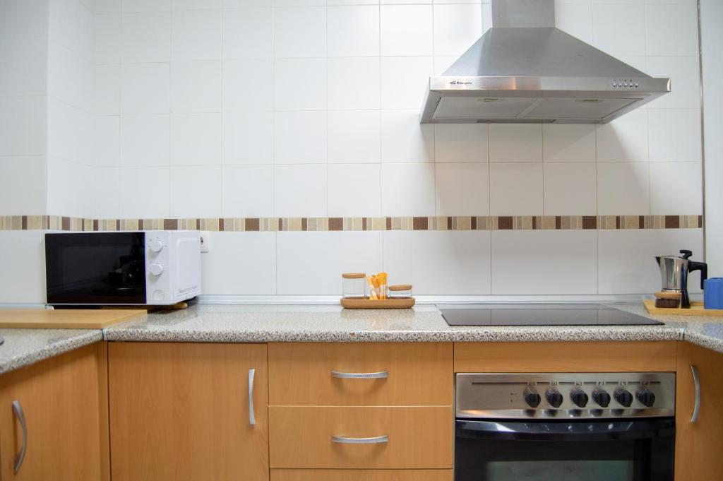 Kuchyňa alebo kuchynka v ubytovaní Novam Apartament