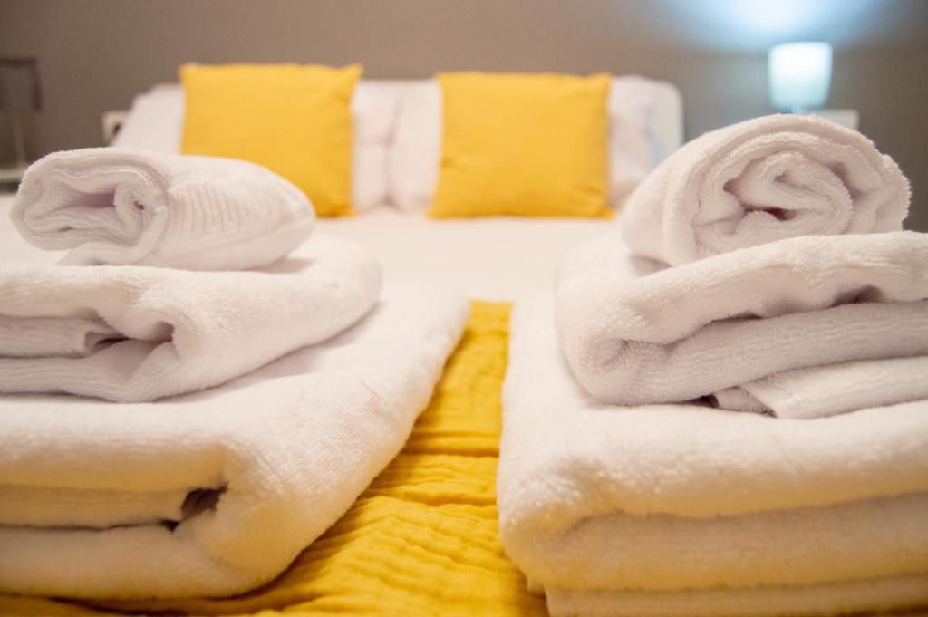 Posteľ alebo postele v izbe v ubytovaní Novam Apartament