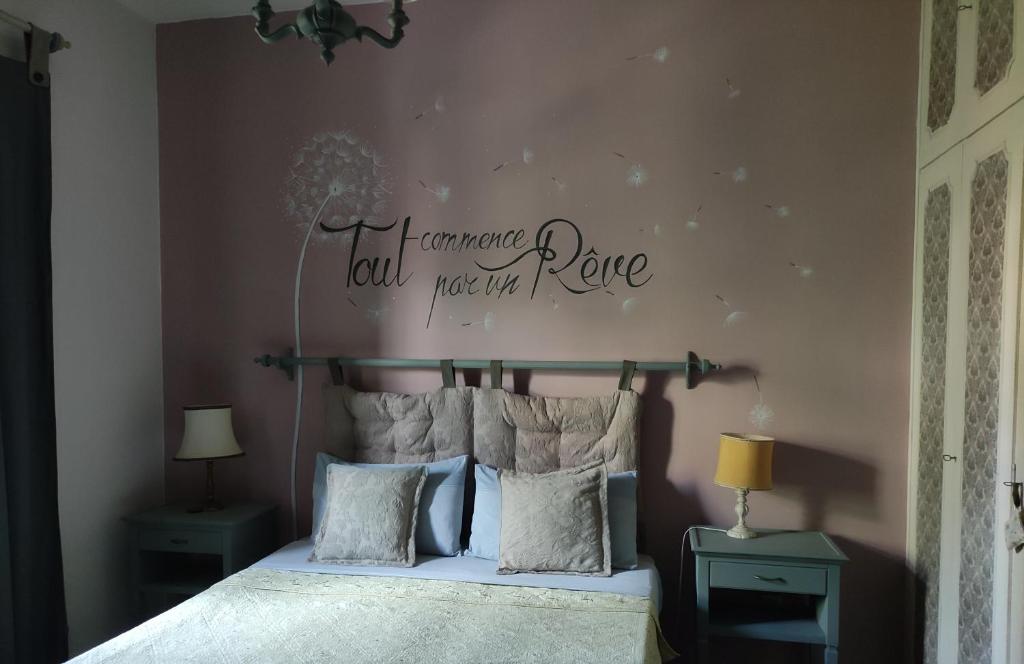 a bedroom with a bed with a sign on the wall at Alloggio turistico Monte Santa Maria in Poggio Nativo