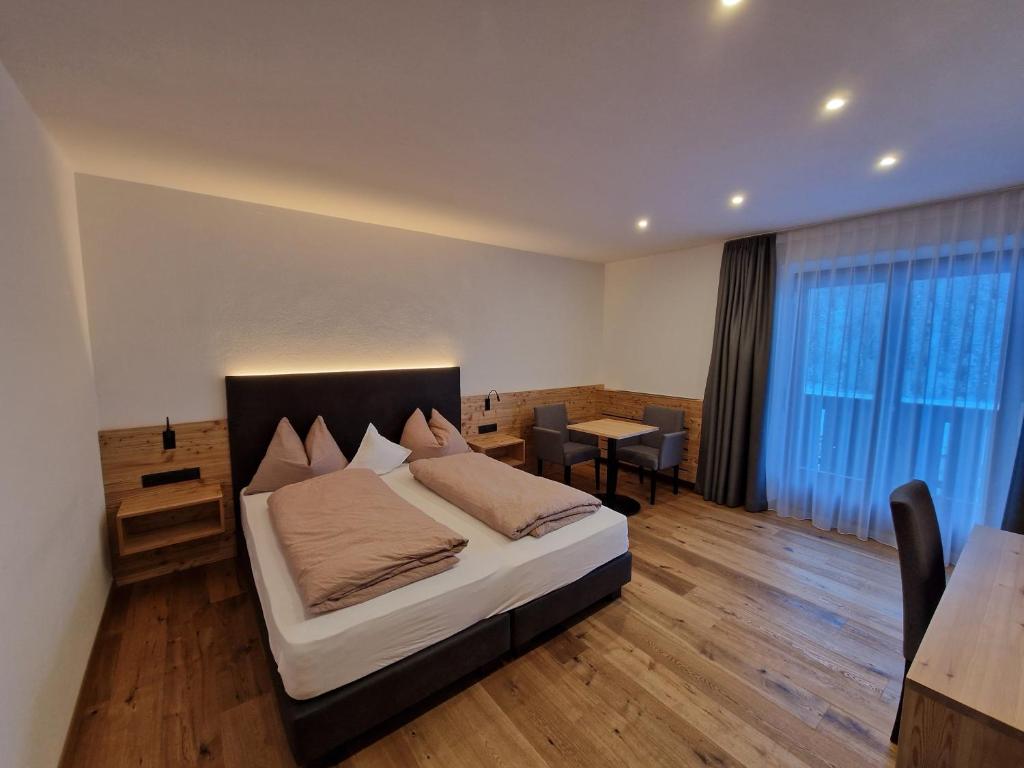 Postel nebo postele na pokoji v ubytování Hotel Mignon
