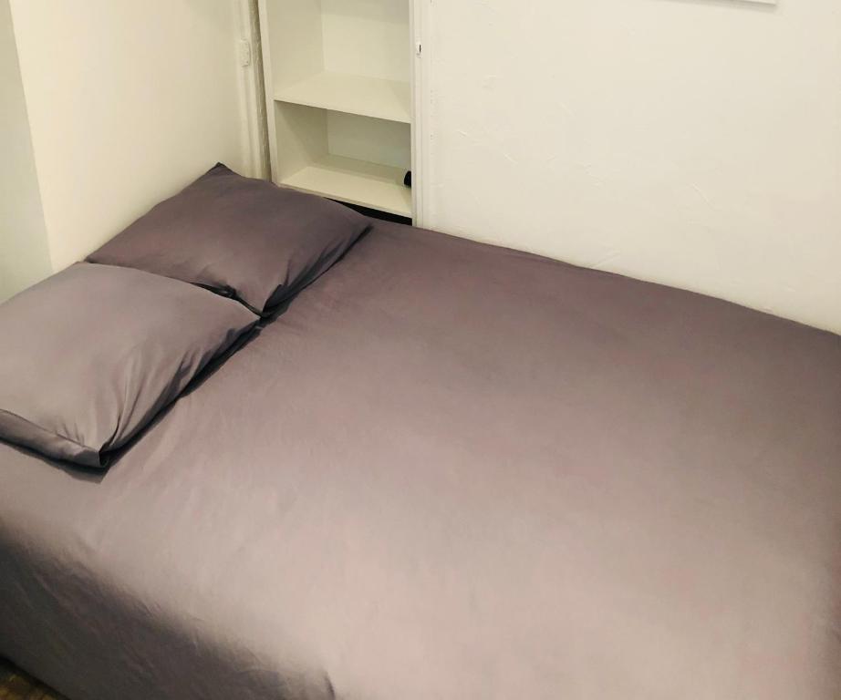 Säng eller sängar i ett rum på Room appart