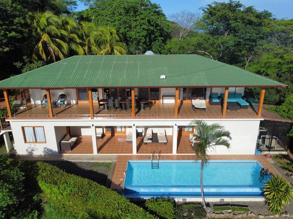 an aerial view of a house with a swimming pool at Bay Villas in El Jobo