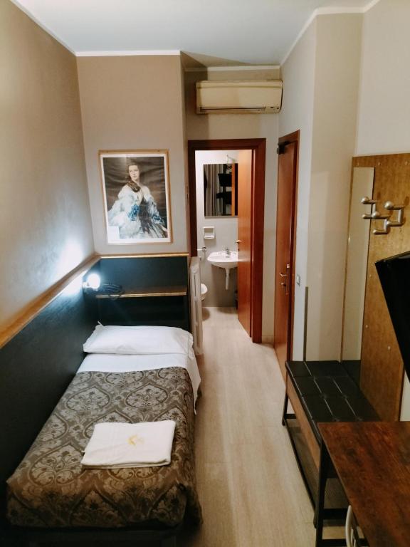 Postel nebo postele na pokoji v ubytování Hotel MM Dateo