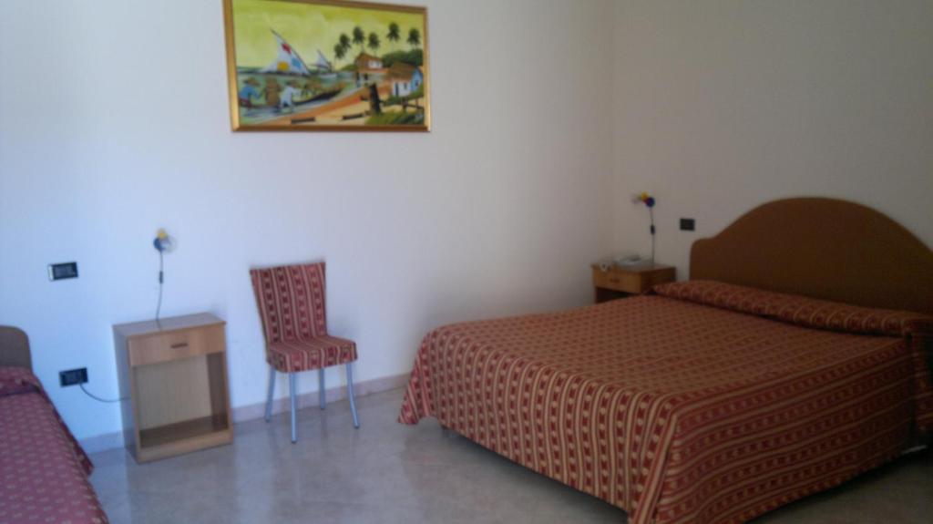 Postel nebo postele na pokoji v ubytování Hotel Genius