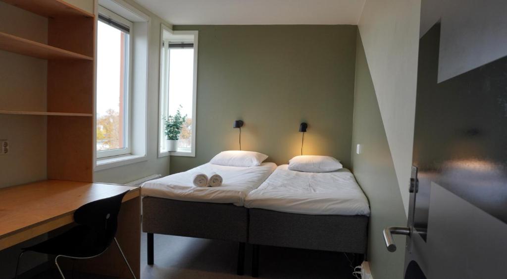 Postel nebo postele na pokoji v ubytování Rumi Hostel