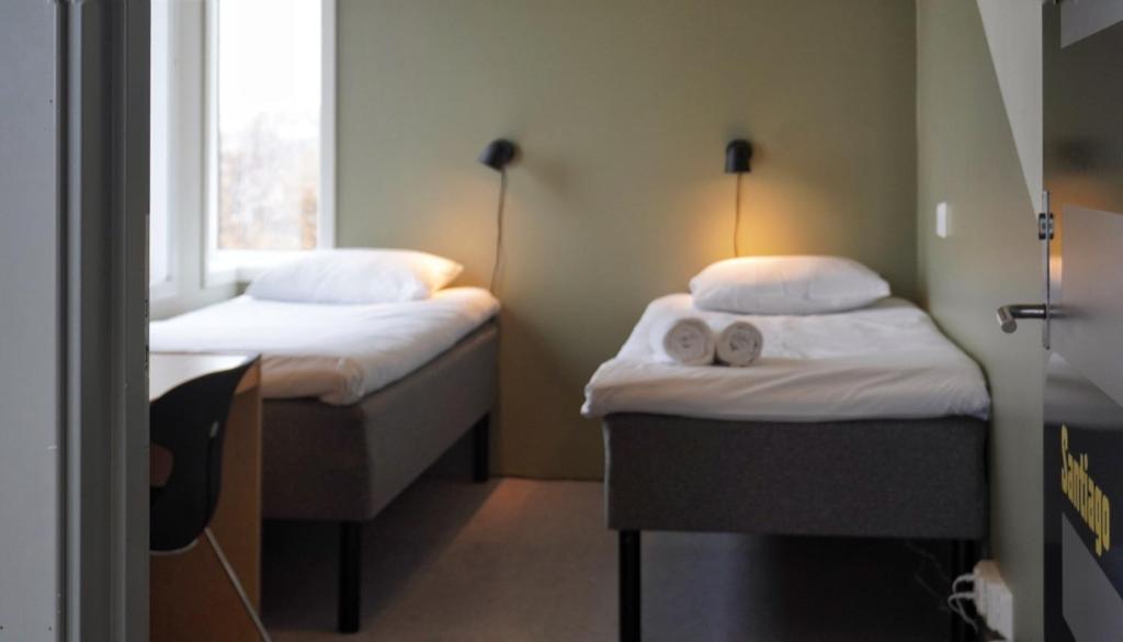 Postel nebo postele na pokoji v ubytování Rumi Hostel