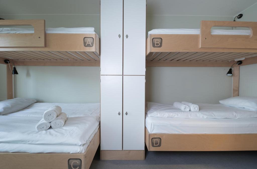 Postel nebo postele na pokoji v ubytování Rumi Hostel