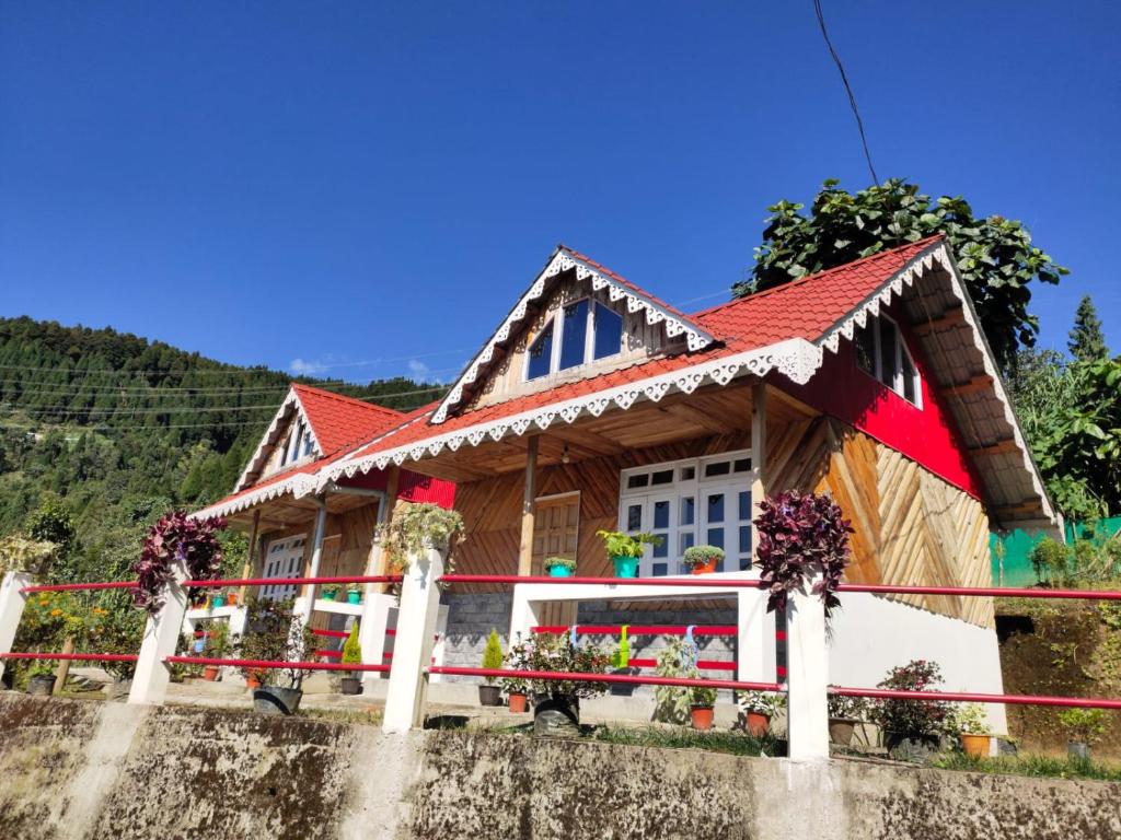 a house with a red roof at Boho Homestay, Rangbhang in Darjeeling