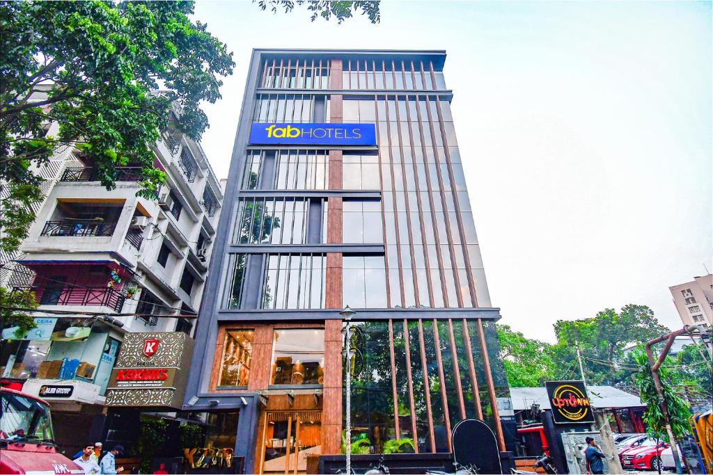 a building with a sign on the side of it at FabHotel Prime Kzar Corporate in Kolkata