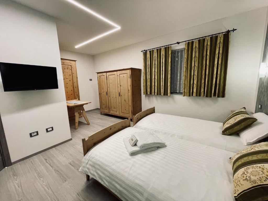 Postel nebo postele na pokoji v ubytování B&B L'Aigual