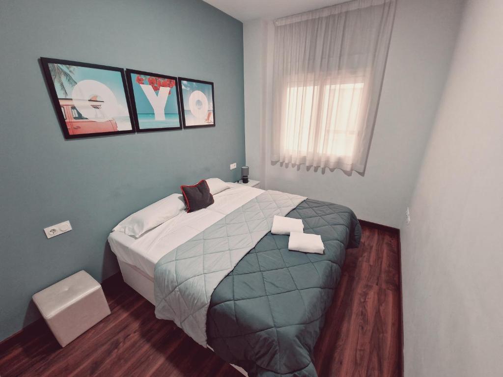 A bed or beds in a room at Luxury Apartments Puerto Valencia