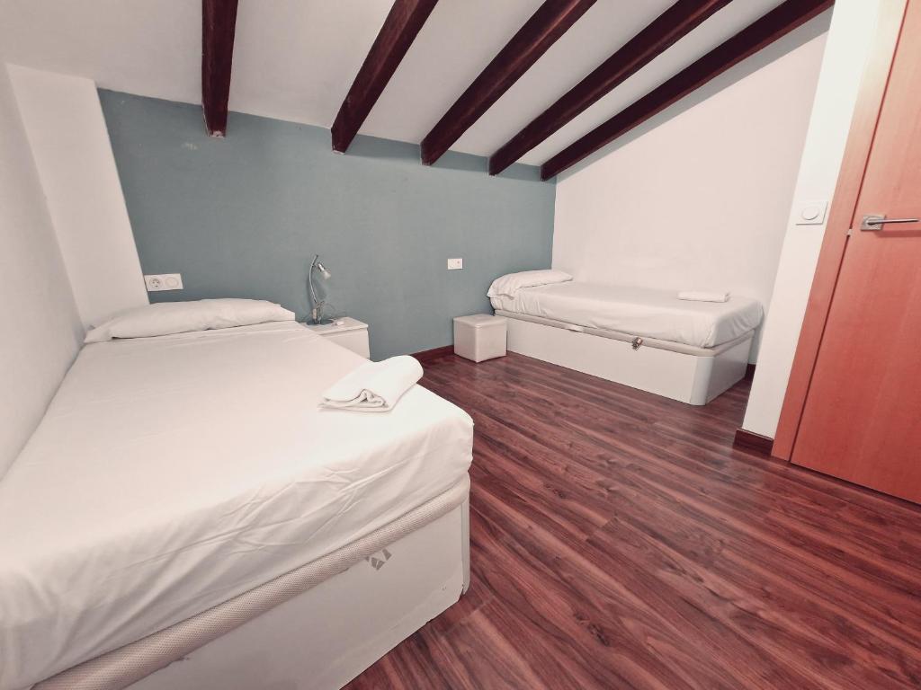A bed or beds in a room at Luxury Apartments Puerto Valencia
