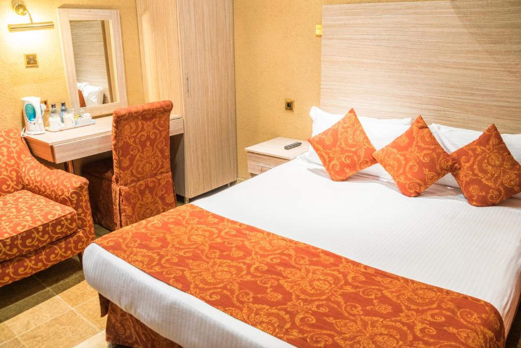 Postel nebo postele na pokoji v ubytování Hotel Waterbuck