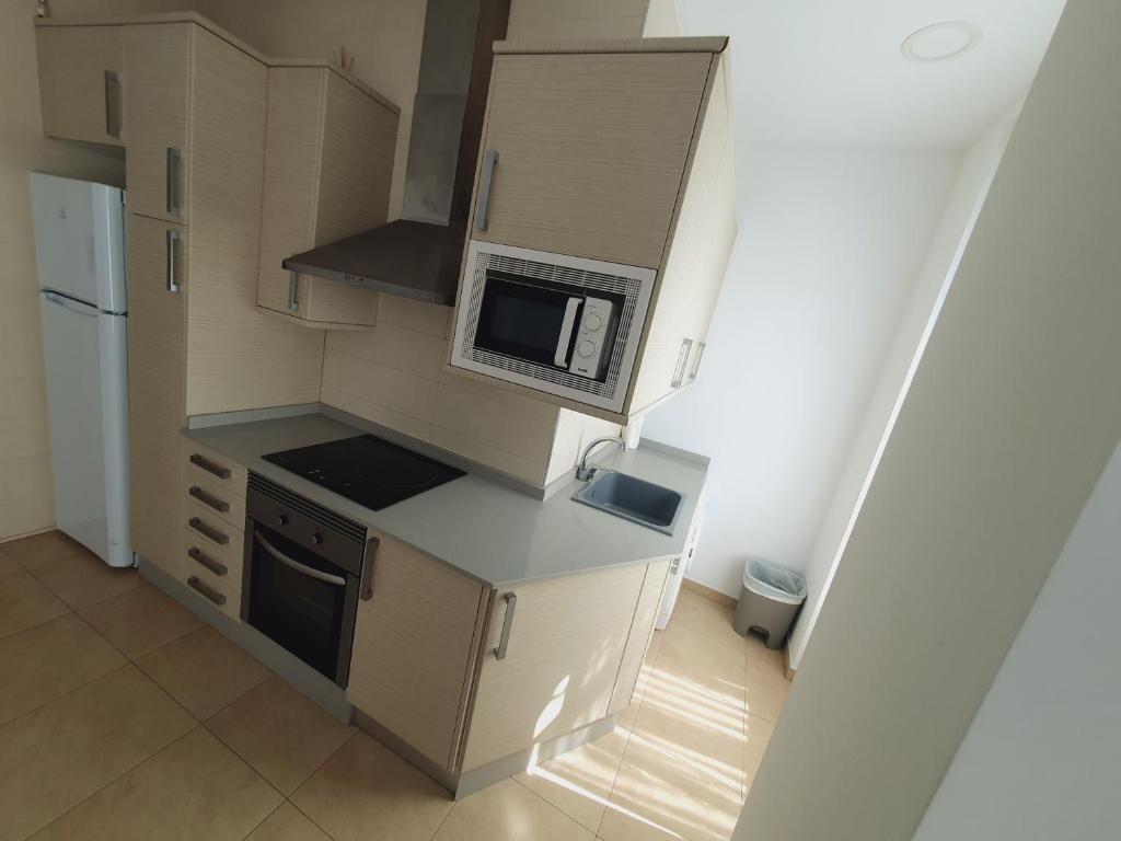 A kitchen or kitchenette at Luxury Apartments Puerto Valencia